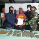 Satgas Yonif 413/Bremoro Tangkap Tangan Pembawa 14 Kantong Ganja