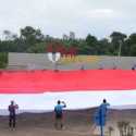 TNI Bentangkan Bendera Merah Putih Raksasa di Titik 0 Km Merauke