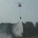 Helikopter Water Bombing Padamkan  Lima Titik Api di Sumsel