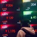 IHSG Rontok 1,29 Persen, Rupiah Cerah ke Rp18.112 per Dolar AS