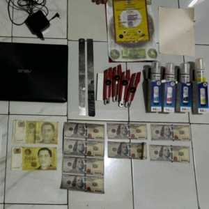 Polisi Tangkap Dua Tersangka Kasus Uang Palsu, Amankan Printer dan Ribuan Lembar Dolar