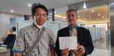 Ketua Umum KAKI, Arifin Nur Cahyono (kiri) saat melaporkan Bank Mandiri dan PT Titan Infra Energi ke Mabes Polri, Rabu (29/6)/RMOL